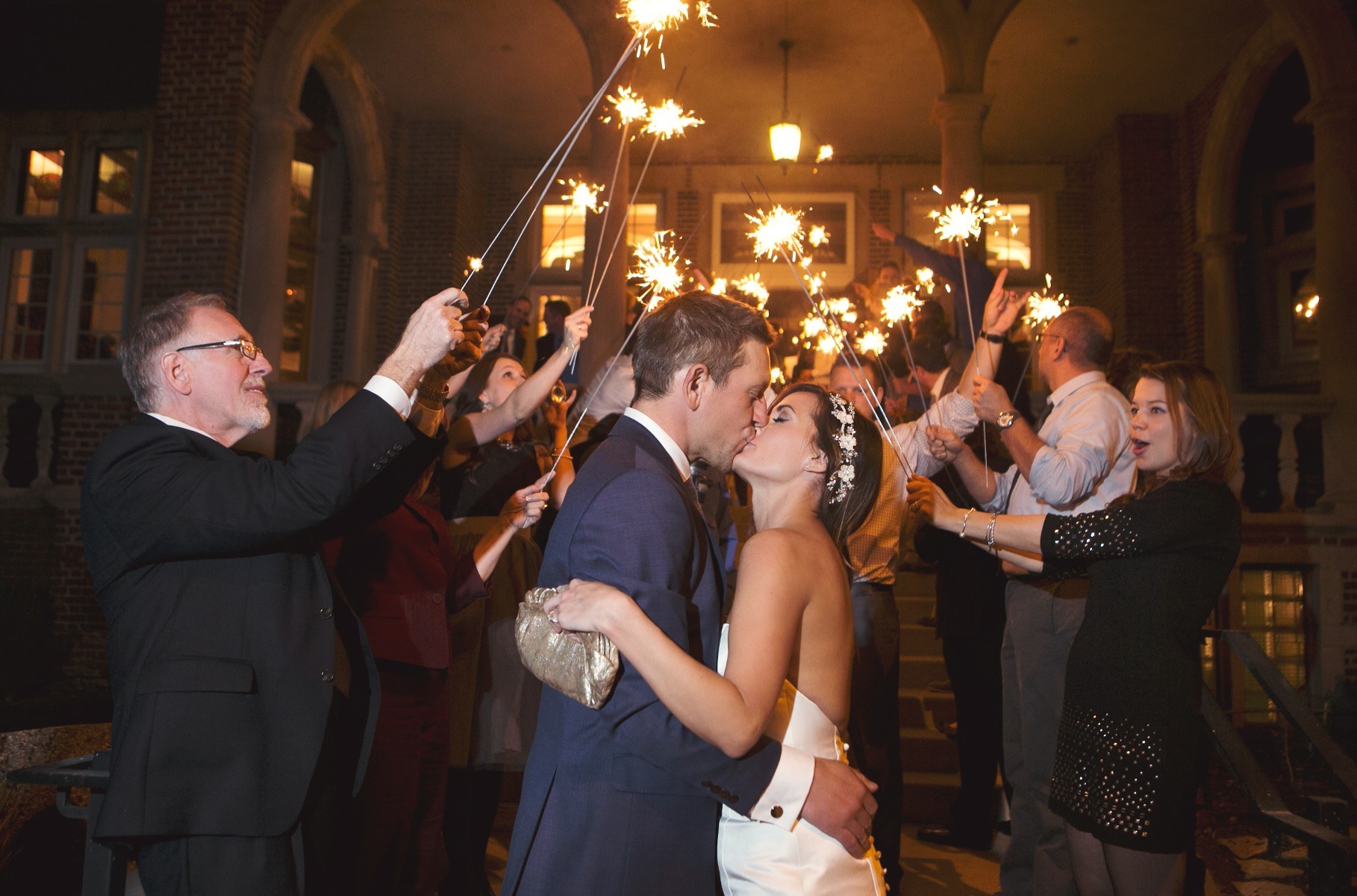 bride & groom kiss at the end of a sparkler send off