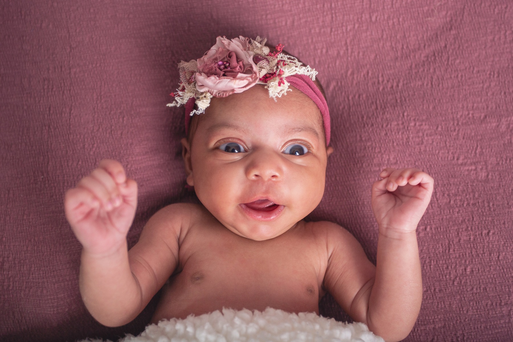 alert newborn girl in maeve headband