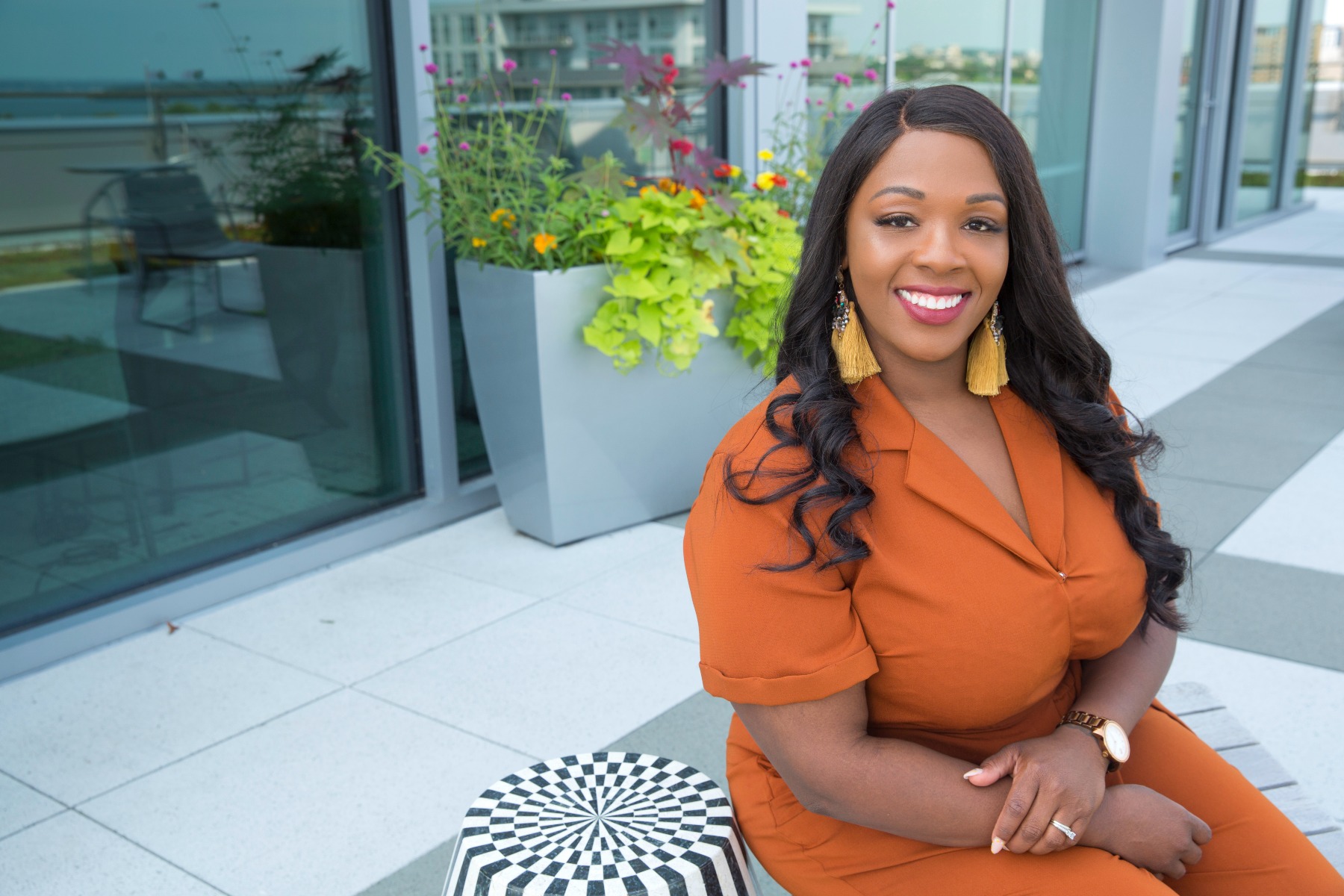 American Family Insurance employee poses on the Spark rooftop
