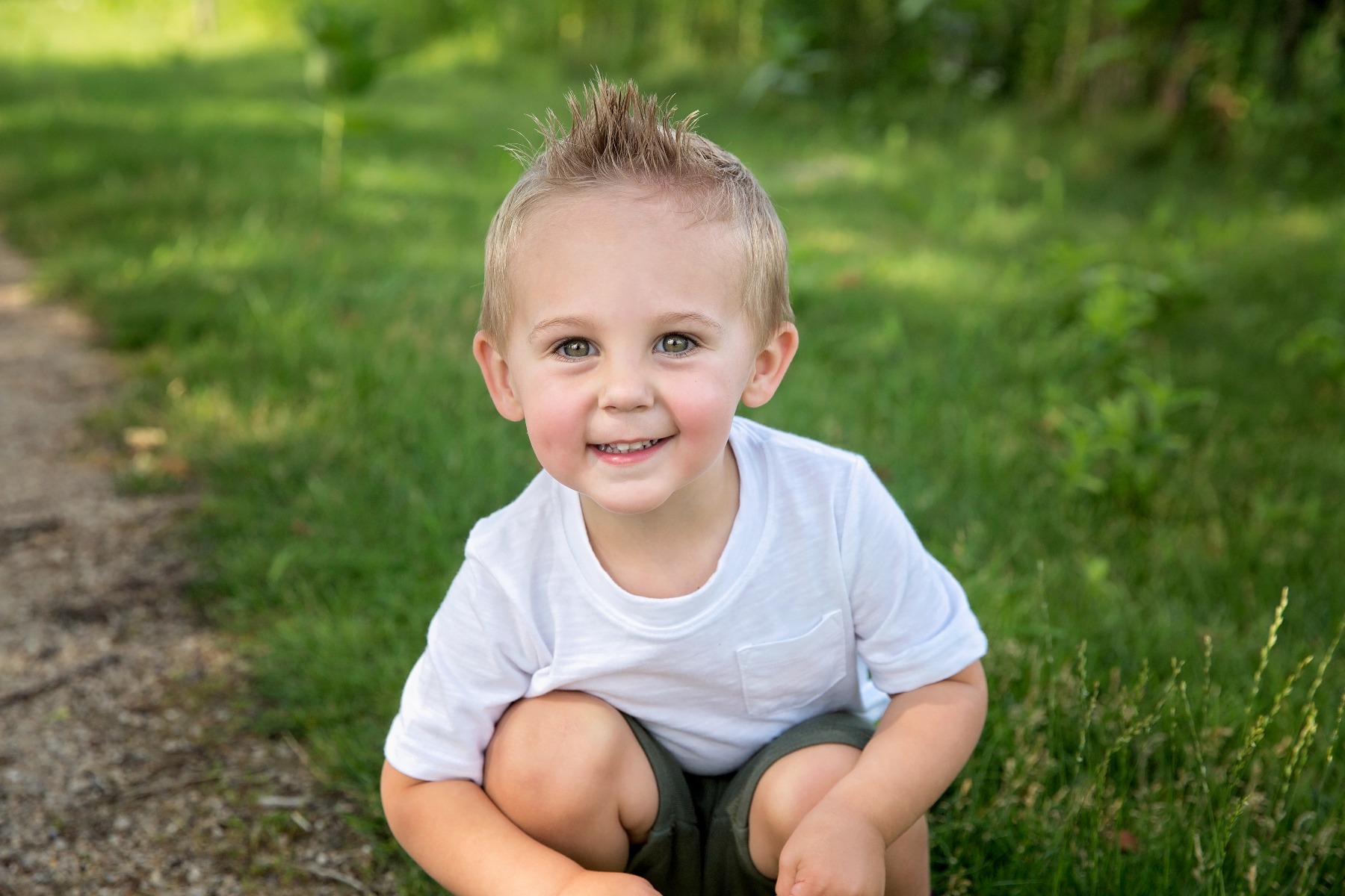 little boy smiles at the camera