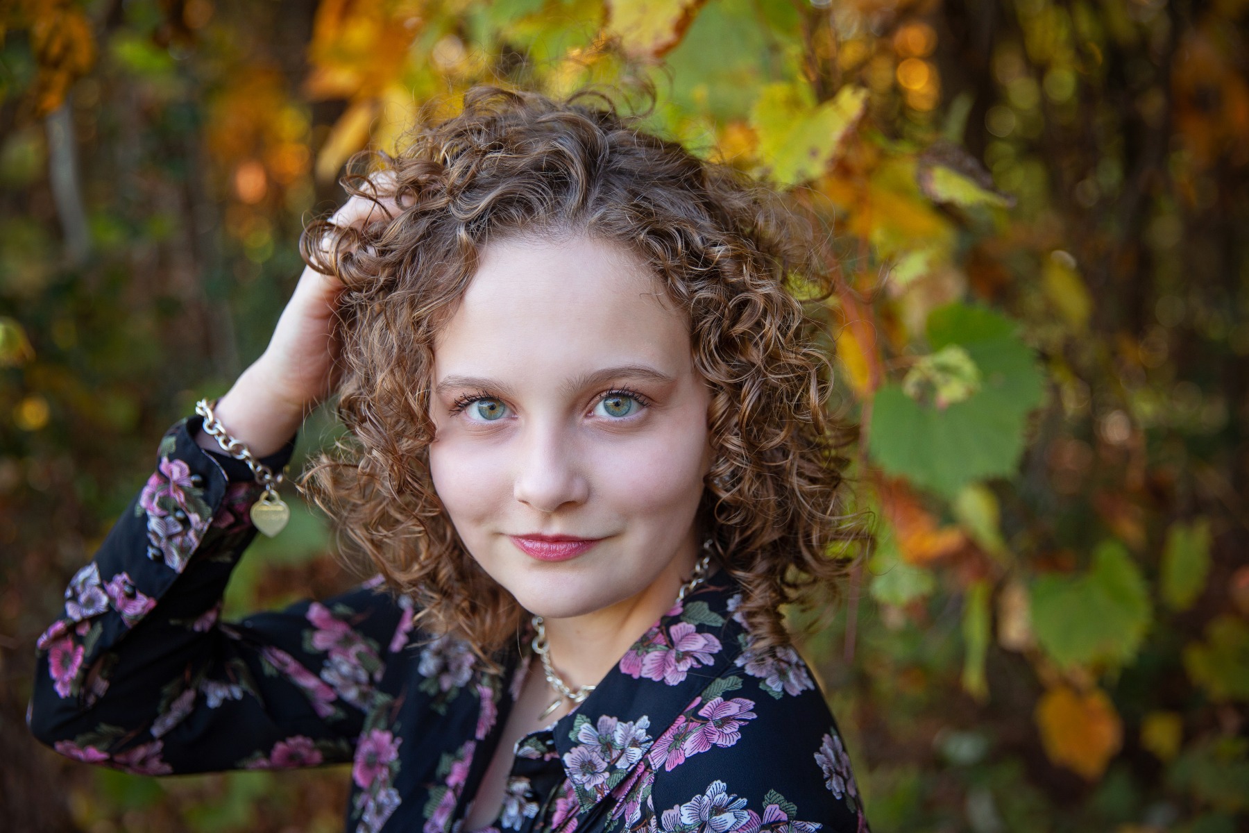 teenage girl by some fall colors
